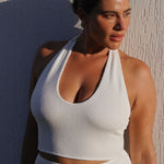White halter bikini top with built-in support, flattering plunge neckline and adjustable tie-neck.