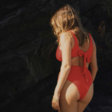 Red high-waisted, cheeky cut bikini bottom made from premium textured 5D fabric with power mesh lining to contour, sculpt and give superior support.