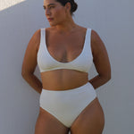 White high-waisted, cheeky cut bikini bottom made from premium textured 5D fabric with power mesh lining to contour, sculpt and give superior support.