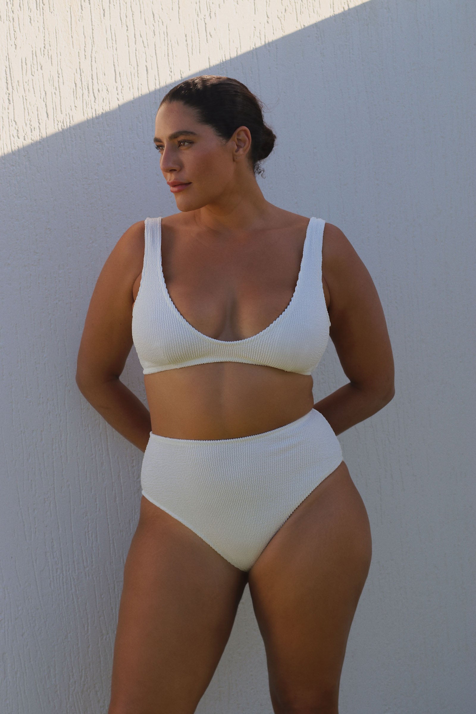 White high-waisted, cheeky cut bikini bottom made from premium textured 5D fabric with power mesh lining to contour, sculpt and give superior support.