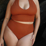 Caramel halter bikini top with built-in support, flattering plunge neckline and adjustable tie-neck.