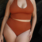 Caramel halter bikini top with built-in support, flattering plunge neckline and adjustable tie-neck.