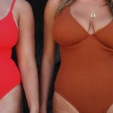 Textured caramel brown full coverage one piece swimsuit with a flattering plunge neckline, underwire bust support and adjustable shoulder straps.