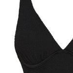 Textured black full coverage one piece swimsuit with a flattering plunge neckline, underwire bust support and adjustable shoulder straps.