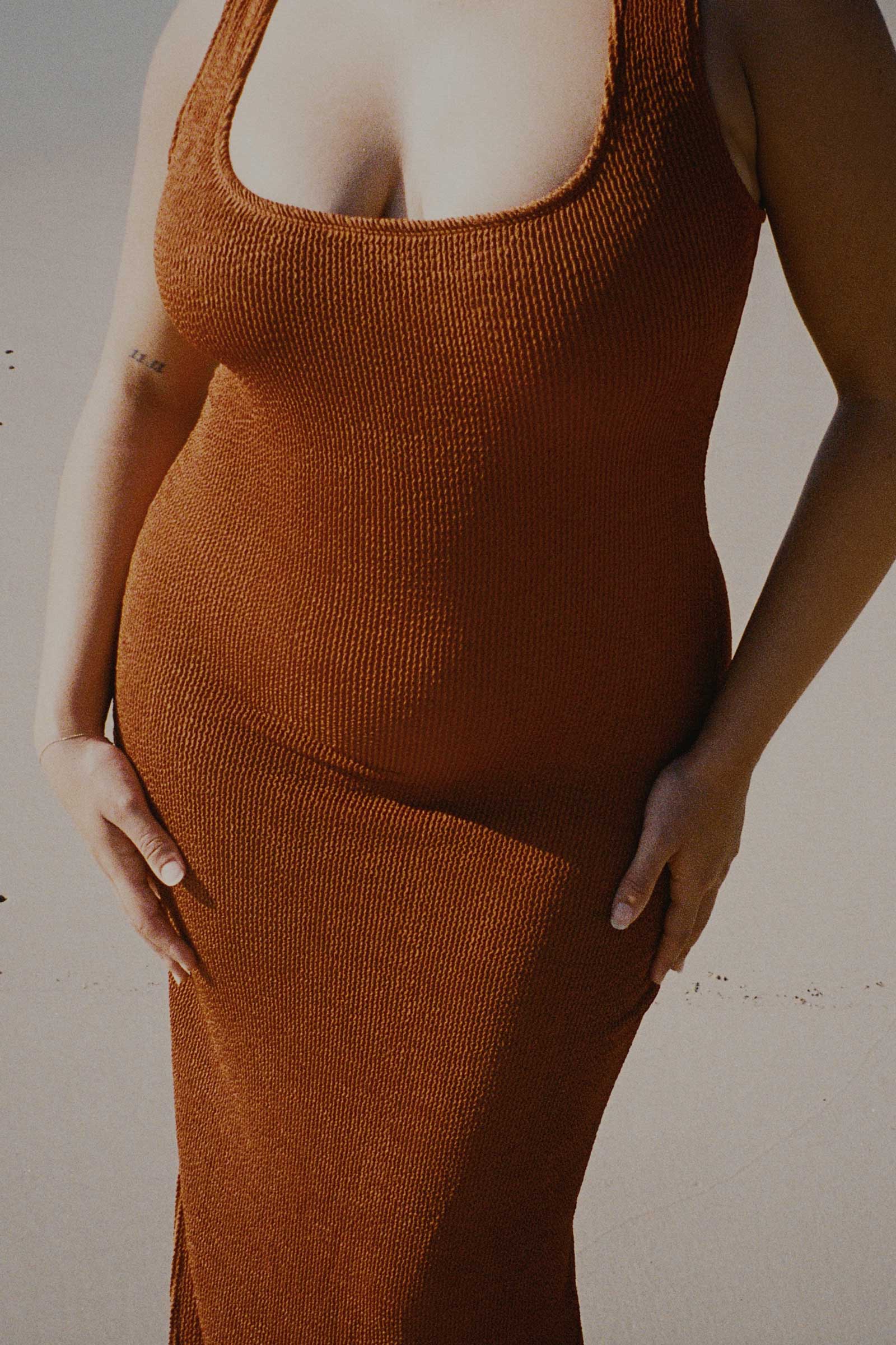 Caramel brown textured bodycon midi dress with inbuilt bra support, square neckline, side split and a sleek, sculpting fit. 