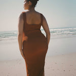 Caramel brown textured bodycon midi dress with inbuilt bra support, square neckline, side split and a sleek, sculpting fit. 