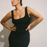 Black textured bodycon midi dress with inbuilt bra support, square neckline, side split and a sleek, sculpting fit. 