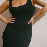 Black textured bodycon midi dress on a curve model with inbuilt bra support, square neckline, side split and a sleek, sculpting fit. 