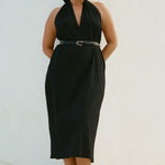 Model wearing Bettina Midi Dress Black with plunge neckline and relaxed fit