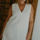 Model Bree McCann wearing Blanca Mini Dress Ecru in lightweight textured linen blend