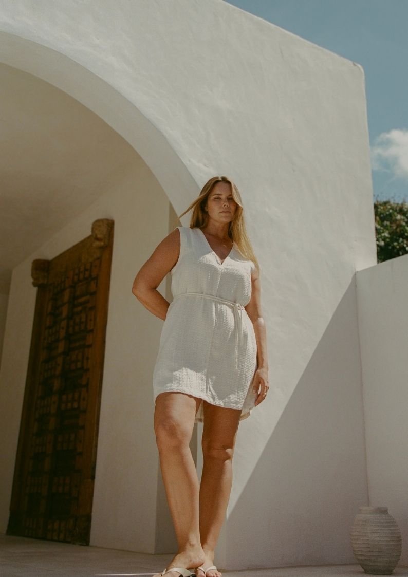 Blanca Mini Dress Ecru styled for coastal summer wear in textured linen