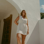 Blanca Mini Dress Ecru styled for coastal summer wear in textured linen