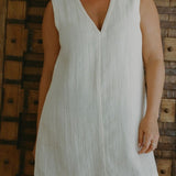 Model wearing Blanca Mini Dress Ecru in lightweight textured linen blend