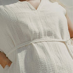 Close-up of Blanca Mini Dress Ecru textured linen waist tie detail