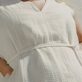 Close-up of Blanca Mini Dress Ecru textured linen waist tie detail