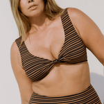 Model Bree McCann wearing mocha stripe supportive bikini top with gathered front detail and wide straps