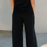 Back view of Echo Pant Black showing relaxed wide leg and elastic waistband