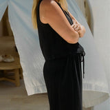 Model wearing Echo Pant Black with relaxed summer silhouette in textured linen