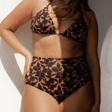 Bokumaia Fior Bottom in Noir Hibiscus floral print – sculpting high-waisted bikini brief on model
